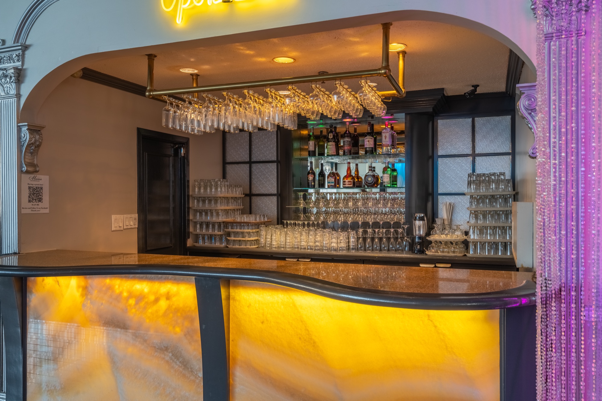 Illuminated bar with hanging glassware
